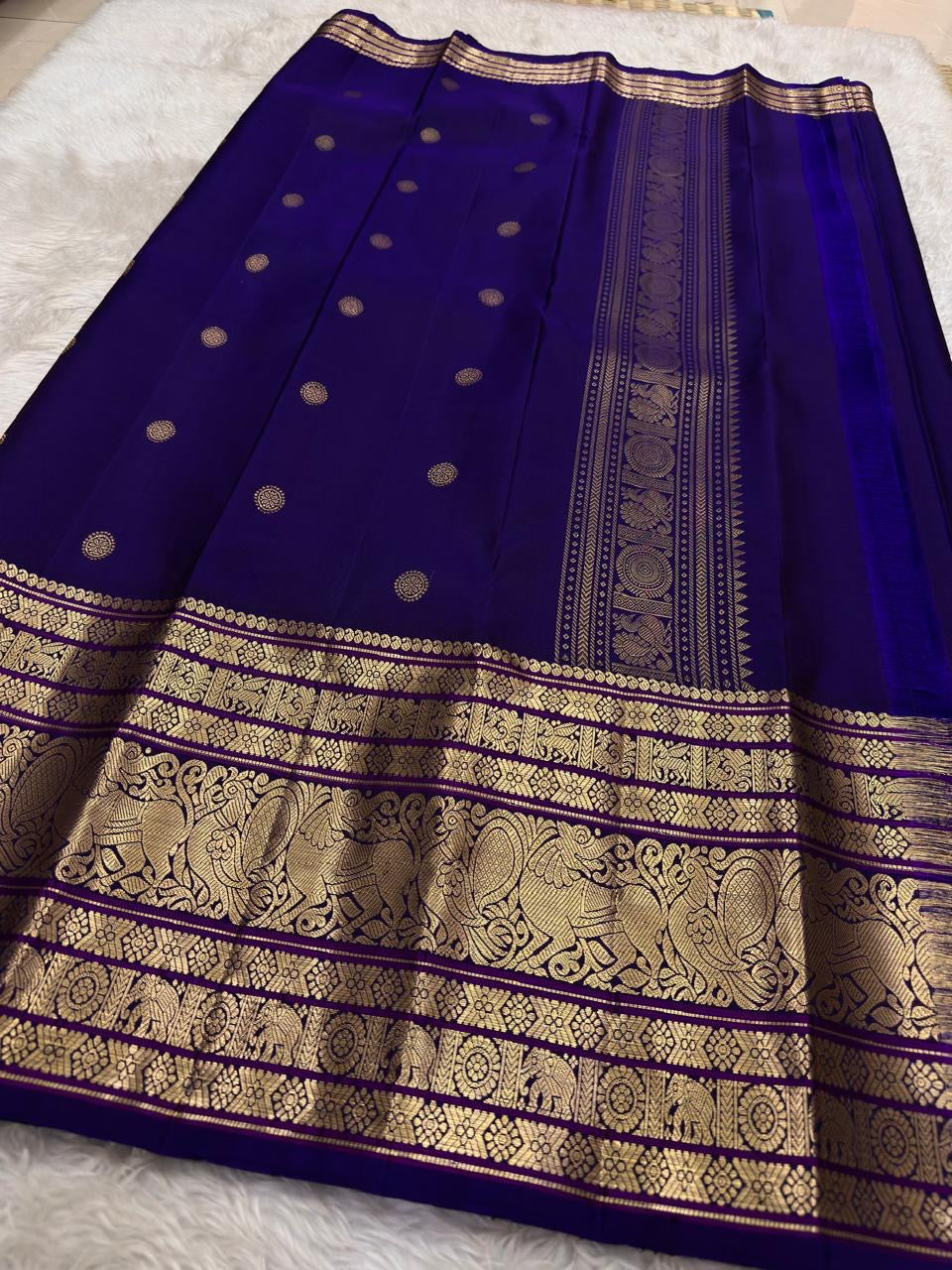 Traditional Kanchipuram Korvai saree in jewel-toned violet with heritage Gandaberunda craftsmanship