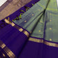 Peacock diamond lattice pallu on a green and violet Kancheepuram saree