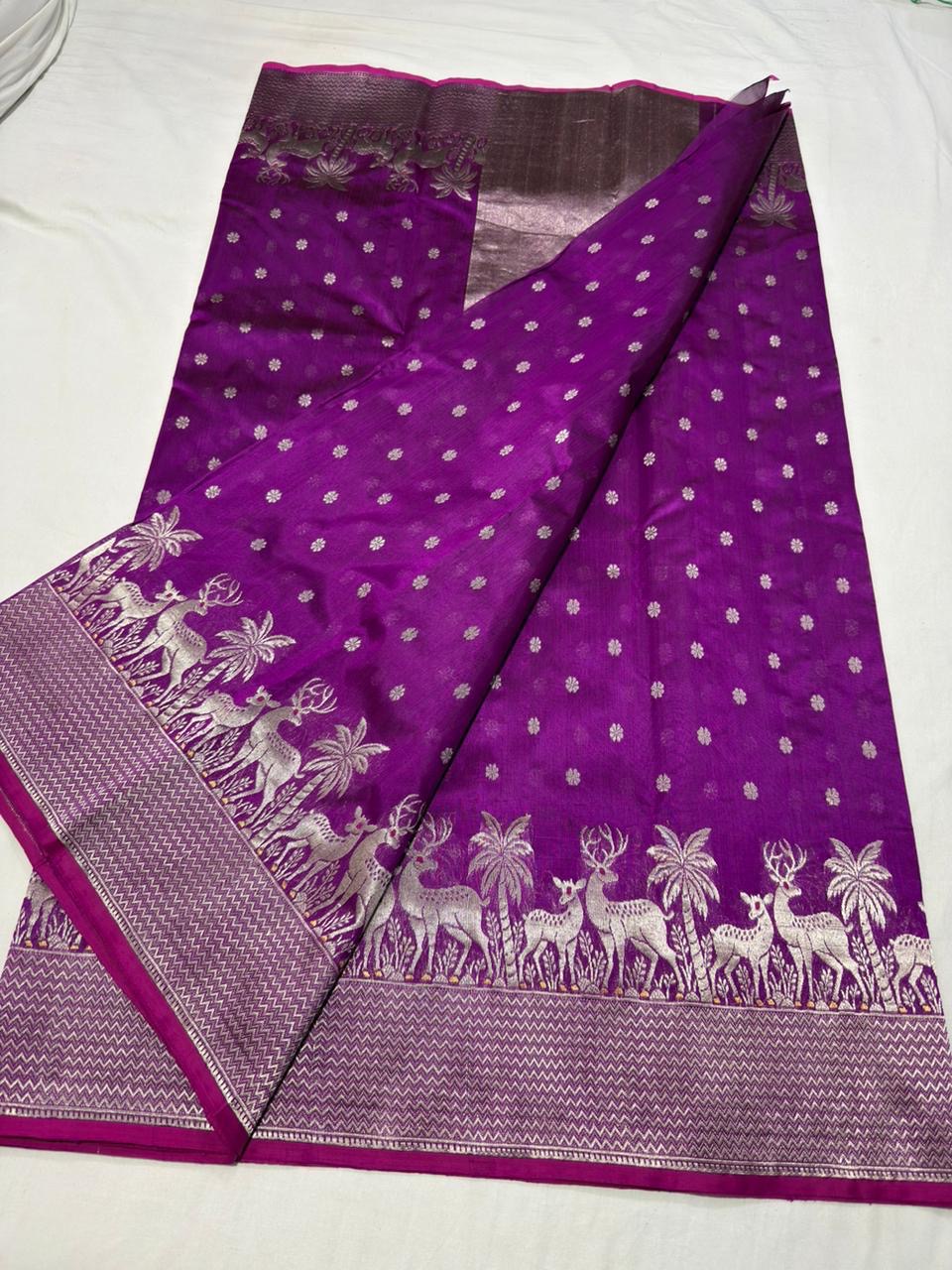 Folded Royal Purple Chanderi saree showing silver floral buttas and woven border detail