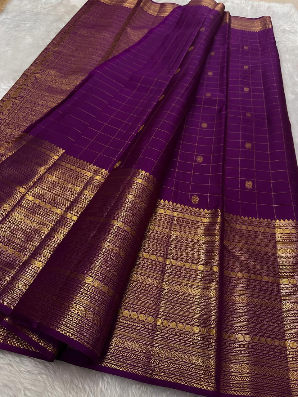 Purple with gold Zari kattam with ornate border pure silk Kanchipuram with mayil chakram zari butta and detailed Pallu