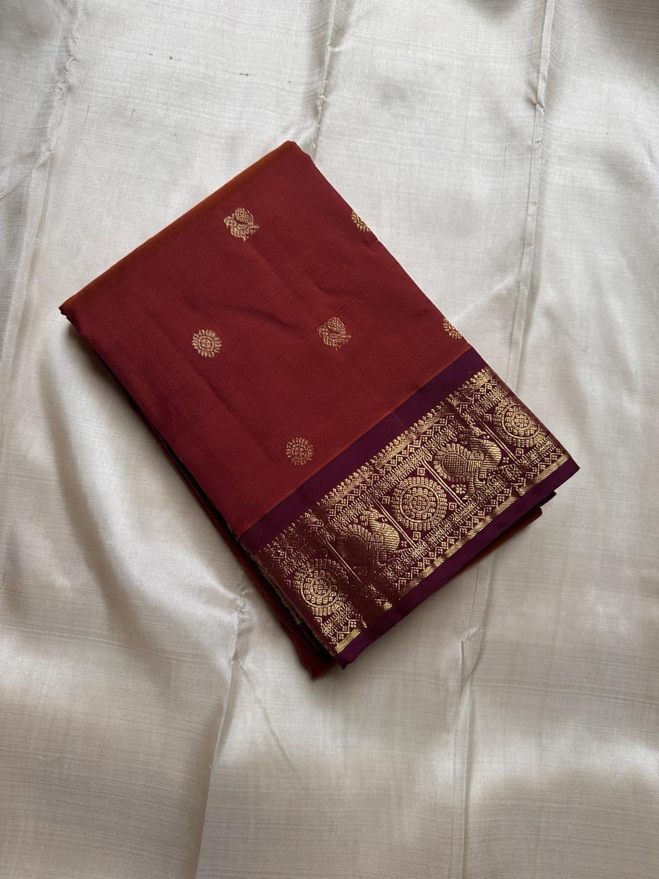 Swaram Lightweight Maroon
Feather-Light Maroon Kanchipuram Silk Saree
Zari-Woven Peacock Medallion Border