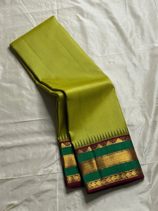 Gita  
Pure Silk Kanchipuram Saree  
Sampanga & Pea Green Podi Kattam  
Arakku Border with Triple Zari Bands