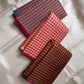 Mutyam – Handwoven Borderless Kanchipuram Pure Silk Saree with Traditional Paalum Pazhamum Baby Checks or kasa kasa kattamDual Contrast Green & Pink Selvedges, and a Subtle Zari Woven Pallu, silk mark certified, ships in two weeks
