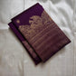 Swarna
Majestic Purple Pure Silk Kanchipuram Saree with Broad Varisaipet Zari Border,Intricately Woven Peacock and Elephant Motifs alongside border . Peacock motifs all over.