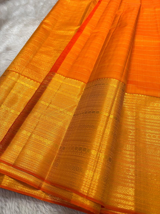 Vibrant orange Zari kattam pre silk Kanchipuram saree
