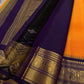 Pure Kanchipuram Silk Saree – Saffron-Orange Body with Gold Zari Paisley Buttas
Contrast Deep Purple Korvai Borders with Intricate Temple & Floral Motifs
Grand Purple Zari Pallu with Diagonal zariWeave . Silk mark , ships in 2 weeks