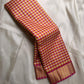 A classic Kanchipuram in Pattani Kattam checks with pink, magenta, mustard, and cream.
Finished with a contrast pink border and pallu.
Paisley and chakram motifs in a graceful grid add timeless charm.