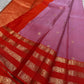 Thamarai Vermillion — Pure Kanchipuram Silk Saree
Soft orchid-pink body with zari lotus buttas and striking vermillion korvai borders, finished with a radiant orange pallu in intricate zari weave.
Silk Mark Certified • Blouse Stitching Available ($30) •