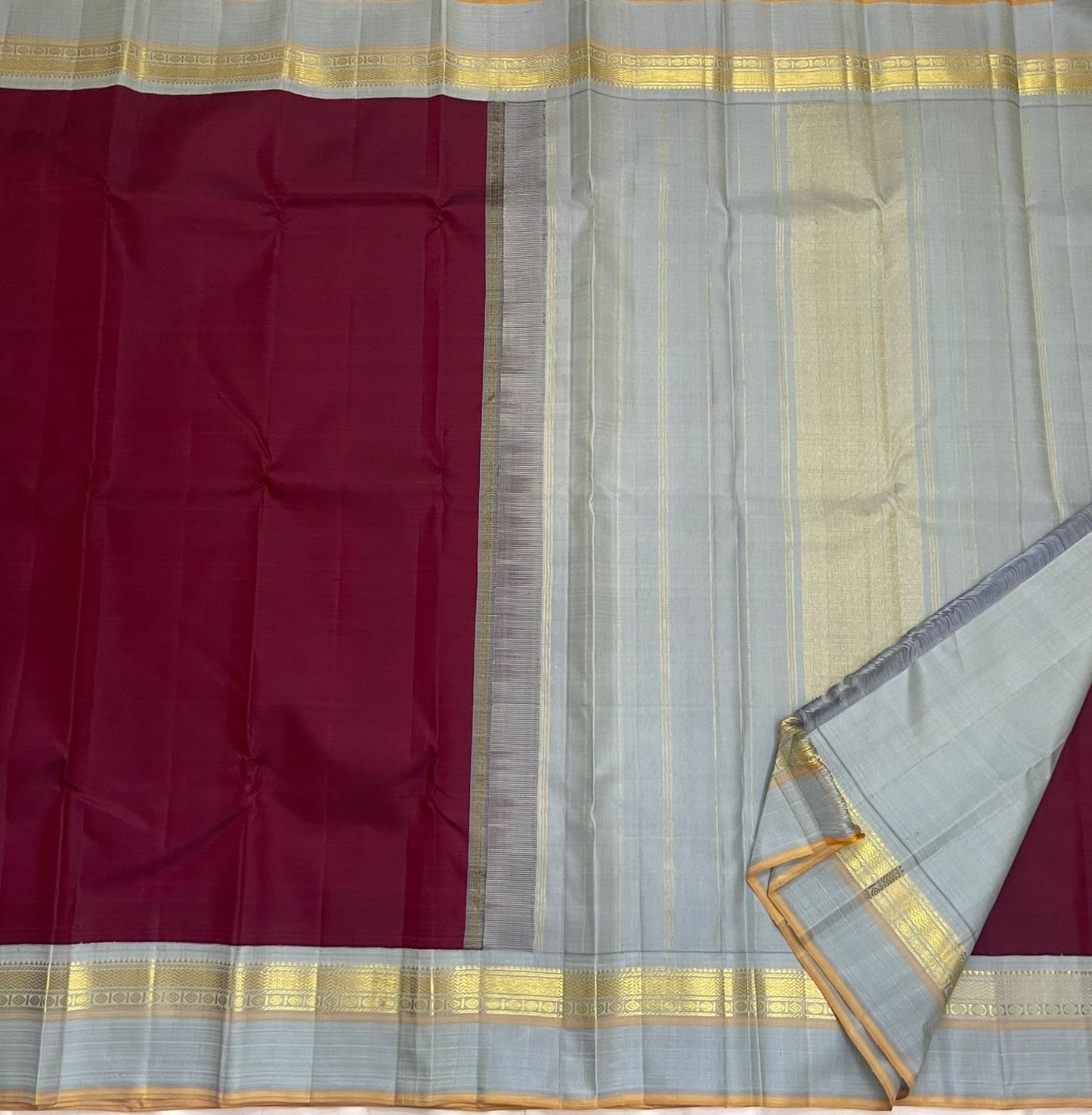 Deep Ruby Dove Grey – Pure Silk Kanchipuram Saree
Korvai Weave with Elegant Contrast Borders
Golden Zari detailed Pallu
Silk Mark Certified | Fall & Pico Done | Blouse Stitching Available ($30)