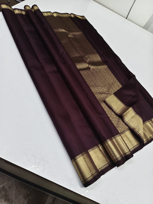 The most exuberant brown in a soft  silk saree, zari border and detailed pallu
