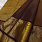Close view of ornate Mayil Chakram zari buttas on the brown silk body.