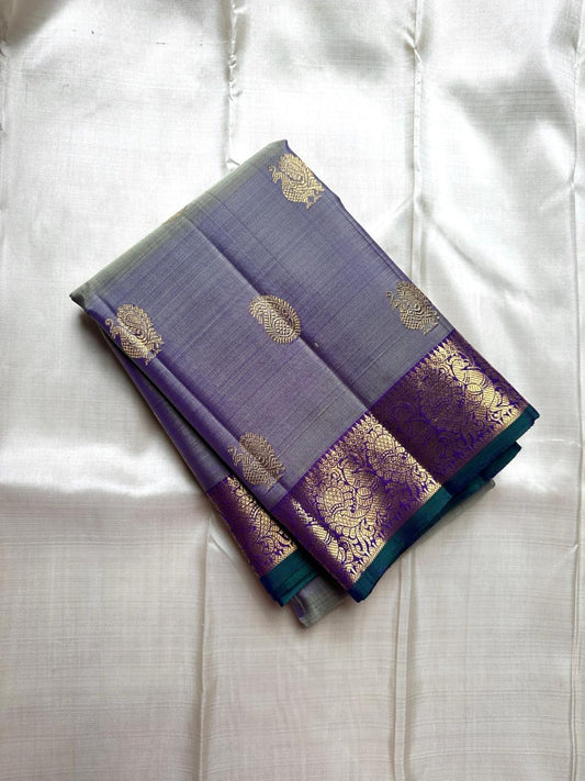 Smoky Lavender
Pure Kanchipuram Handloom Silk Saree
Gold Peacock Zari • Korvai Grandeur