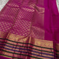 Kaamini ✨ — Fuschia Pure Kanchipuram Silk Saree
With Scattered Gold Zari Buttas on Lustrous Body
Bold Striped Korvai Border in Green & Blue Accents
Grand Fuschia Pallu Woven in Intricate Gold Zari
Contrast Blouse with Matching Zari Border Finish