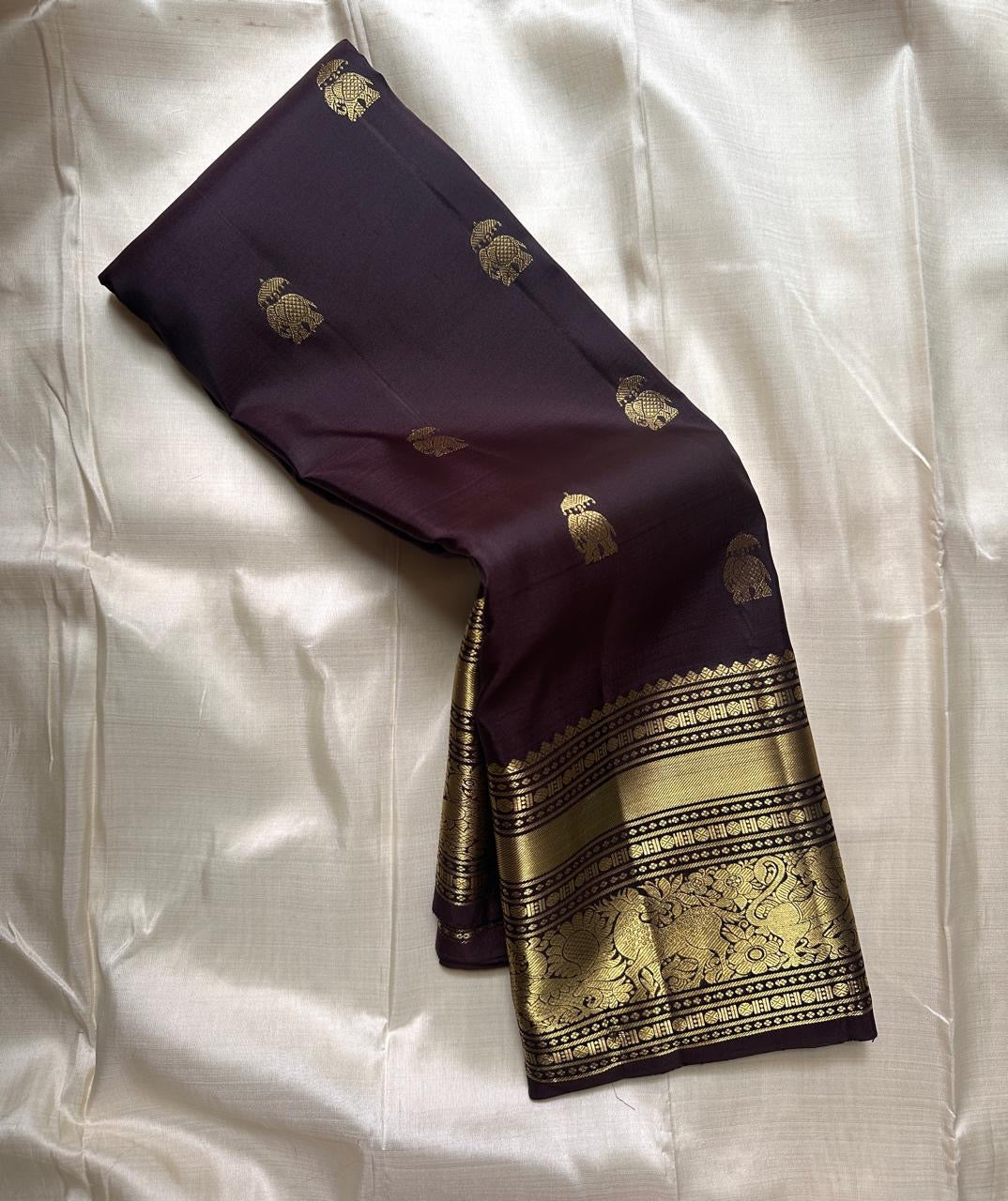 Deep plum Kanchipuram silk saree with gold annapakshi zari buttas
