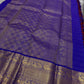 Raaga – Red and Blue Pure Kanchipuram Silk Saree with Gold Zari Border
Features a striped red body with small gold buttas and a royal blue pallu.
Finished with intricately woven peacock motifs in pure zari across the border.
