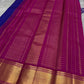 Sapphire Zari Kattam – Pure Kanchipuram Silk Saree
Brilliant Sapphire Blue Body with Gold Zari Checks
Broad Golden Border with Magenta Highlights & Temple Motifs
Royal Magenta Pallu with Lustrous Zari Stripes

Silk Mark Certified, delivery in 2 weeks