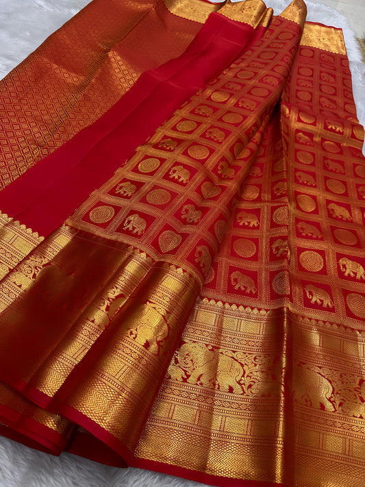 Opulent red Zari kattam with elephant and kamalam motifs spread all over pure silk Kanchipuram saree