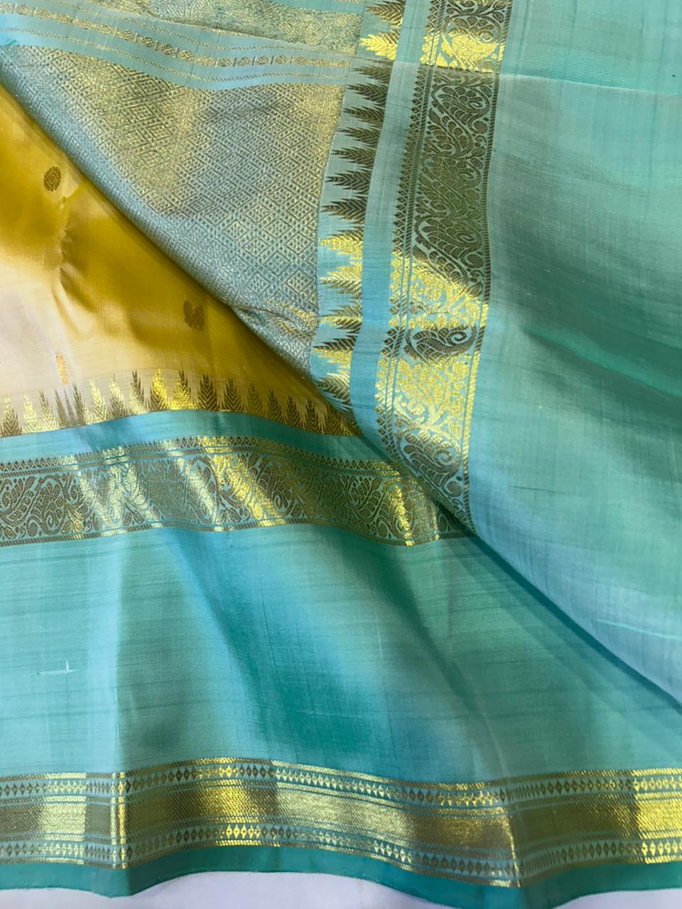 Sunlit Butter Yellow ✨ – Pure Kanchipuram Silk Saree in Butter Yellow & Sea Green with Gold Zari Temple Border & Grand Brocade Pallu – Silk Mark Certified, Fall & Pico Done, Blouse Stitching Available, ships in 2 weeks