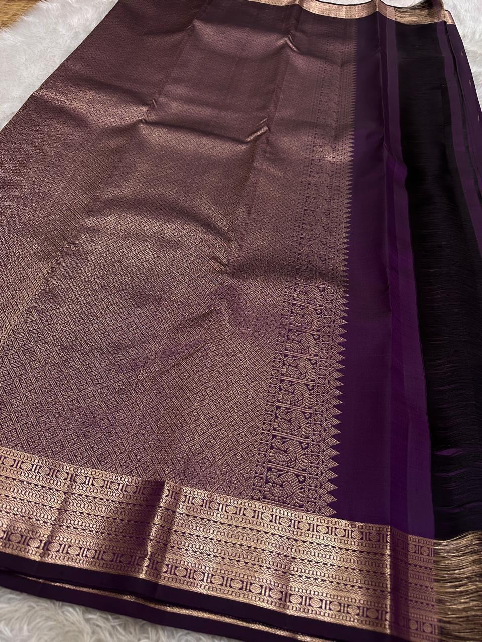 Vibha plum - A Deep Plum Pure Kanchipuram Silk Saree Blending the Grandeur of South Indian Weaving with Paithani-Inspired Floral Zari Borders and a Lustrous Rose Gold zari Pallu