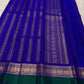 Vivid Neelam Blue and Emerald Green pure silk Kanchipuram Varisaipet saree, folded handwoven silk fabric.