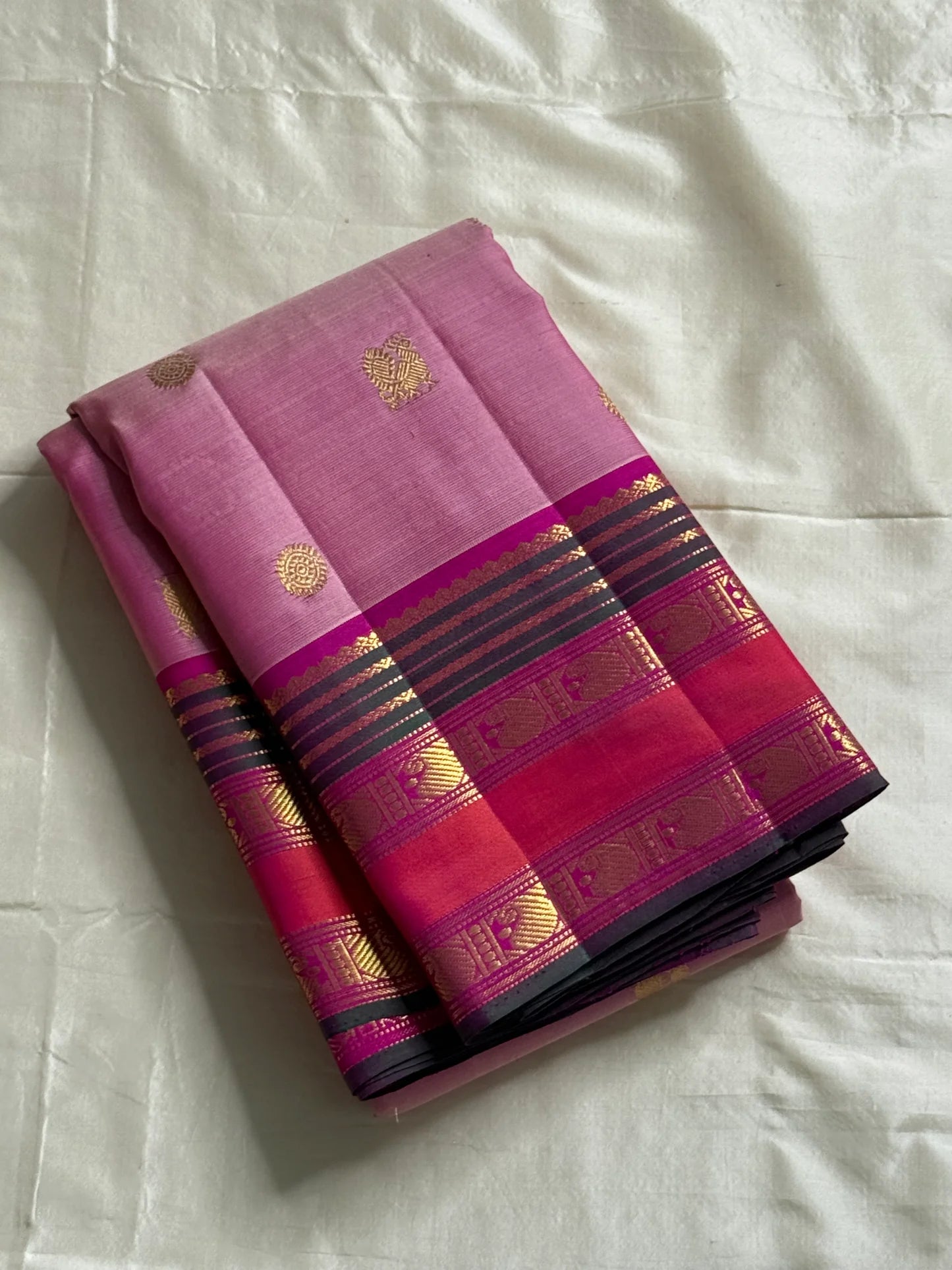 Pink Ombre Kanchipuram Pure Silk

Fuchsia Korvai Border • Charcoal stripes

Gold Zari Buttas (chakram & mango)

Rich zAri Pallu • Blouse included

Silk Mark Certified • Free USA Shipping • Ships in Two Weeks

— Pink Ombre Butta Korvai