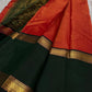 A festive radiant orange silk saree with a rich vairaoosi all over bottle green  border, woven to celebrate tradition with a bold flair.