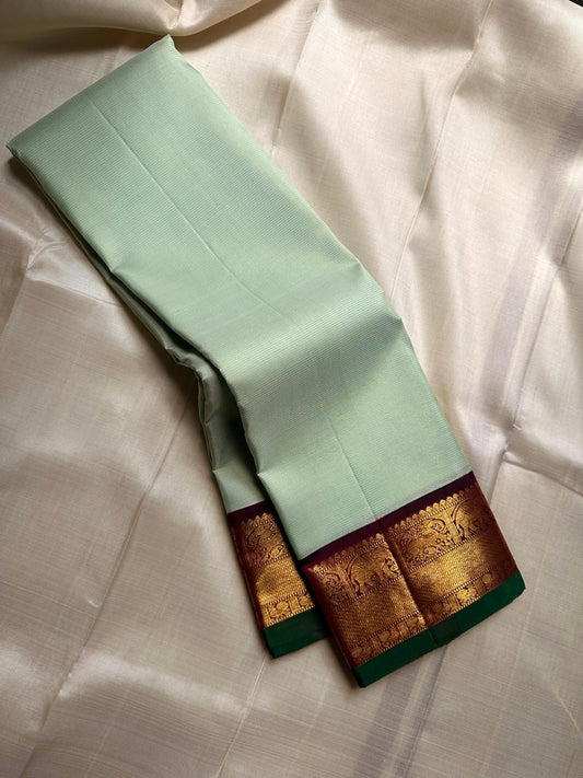 Pistachio Mist ✨ – Pastel Pistachio Vairaoosi Kanchipuram Pure Silk Saree
Korvai Wine-Maroon Border with Elephant Procession Zari Panel & Green Selvedge
Grand Gold Zari Pallu with Chevron & Silk Mark Certified | Fall & Pico Done | Blouse Stitching ($30) |