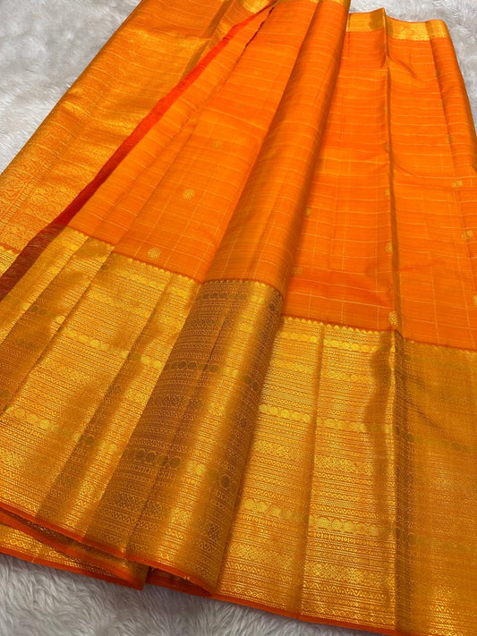 Vibrant orange Zari kattam pre silk Kanchipuram saree