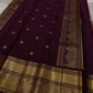 Pari is a graceful Kanchipuram pure silk saree in a serene copper-rose gold brown hue. Scattered peacock zari buttas .  Framed by an antique-gold korvai border temple-inspired yali, annam, and floral medallions, finished with a deep wine-maroon Pallu