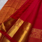 Overall floral jaal woven across the vermilion red Kanchipuram saree body