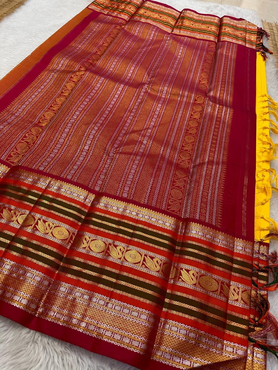 Bhavya – Mustard & Maroon Kanchipuram Pure Silk Saree
Featuring Lotus & hamsa  Motifs in Luxurious Sonaroopa Zari
A Timeless Elegance Woven for Celebrations and Special Moments