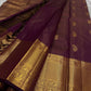 Varnika – Handwoven Kanchipuram Silk Saree in Plum Wine
A regal plum Kanchipuram silk saree adorned with gold zari paisleys and Gandaberunda motifs