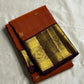 Rust Orange Supreme – Korvai Kanchipuram Pure Silk Saree
Shot rust-orange body with gold chakram & mankolam buttas all over
Deep purple korvai border with annam & chakram zari medallions
Rich vadamalli zari-brocade pallu | Contrast blouse | Fall & Pico Do