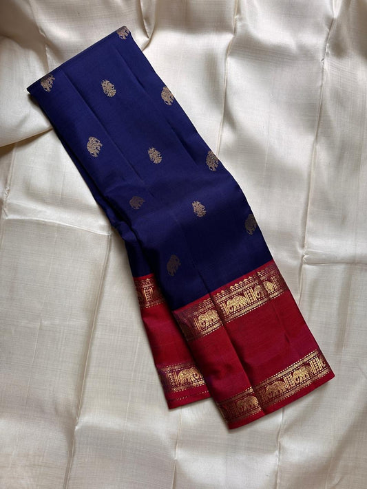 Pure silk kanchipuram deep ink  blue  with red border reaper elephant border , elephant and Gandaberunda butta in zari all over  body