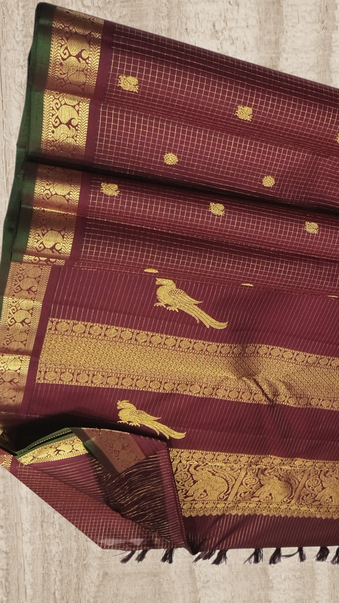 Coffee brown Zari kattam with paisley peacock border kamalam butta and green selvedge , kilo kanjivaram Pallu in pure silk