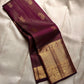Varnika – Handwoven Kanchipuram Silk Saree in Plum Wine
A regal plum Kanchipuram silk saree adorned with gold zari paisleys and Gandaberunda motifs