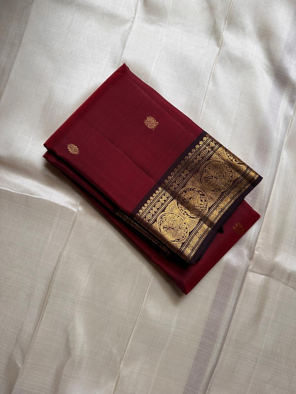 Raaga Deep Red
Garnet-Red Kanchipuram Silk Saree
Zari Medallion Border & Heritage Buttas