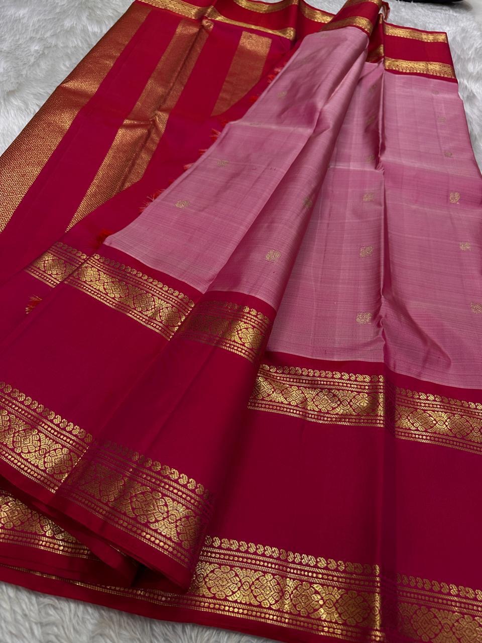 Pure silk kanchipuram rose pink color body with zari mayil chakram  buttas , raspberry pink  border with ornate Pallu