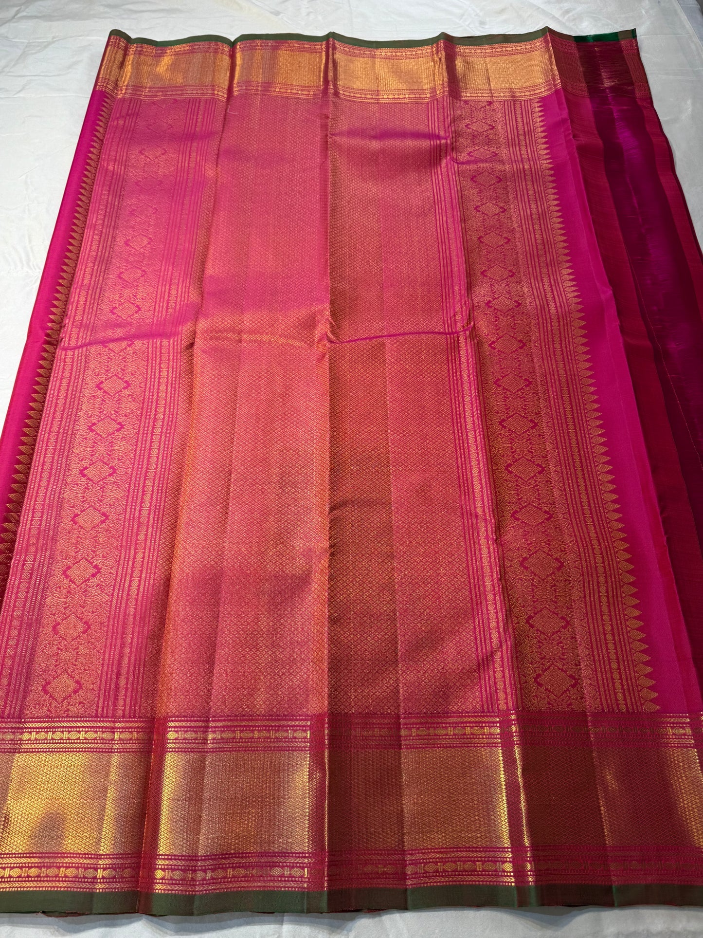 Kalpana  
Pure Silk Kanchipuram Saree  
Burnt Orange with Golden Buttas  
Intricate Magenta & Gold Zari Border