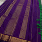 Varnam is a pure Kanchipuram silk saree in rich emerald green with subtle dual-tone shading. Woven gold zari buttas dot the body, while a petite purple border woven with intricate zari adds refined contrast. Arai maadam Pallu, jewel toned classic !