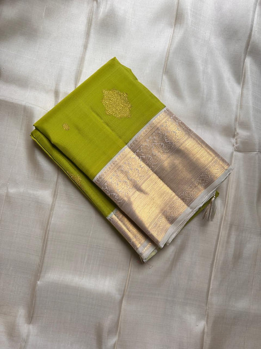 Fresh green pure silk Kanchipuram with cream floral butta