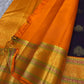 Jamun Purple Kesar – Korvai Kanchipuram Pure Silk Saree

Regal jamun-purple body adorned with antique-gold floral buttas

Kesari-orange korvai border with chakra roundels, vines & chevron zari

Free shipping withinUSA silk mark certified ships in 2 weeks