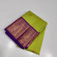 Verdant Gold ✨ – Parrot Green & Violet Pure Kanchipuram Silk Saree
 Gold Zari Buttas in Kattam Weave
Violet Korvai Border with Peacock & Floral Zari Motifs
Grand Violet Brocade Pallu with  Tassels done 
Violet Blouse with Zari Border | Silk Mark