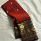 Aruna Mayil – Pure Korvai Kanchipuram Silk Saree

Brick red body with zari rosette buttas

Grand coffee-brown korvai border & pallu with peacock panels, medallions & temple teeth in rich gold zari

Silk Mark Certified | Blouse Piece Included | Fall & Pico