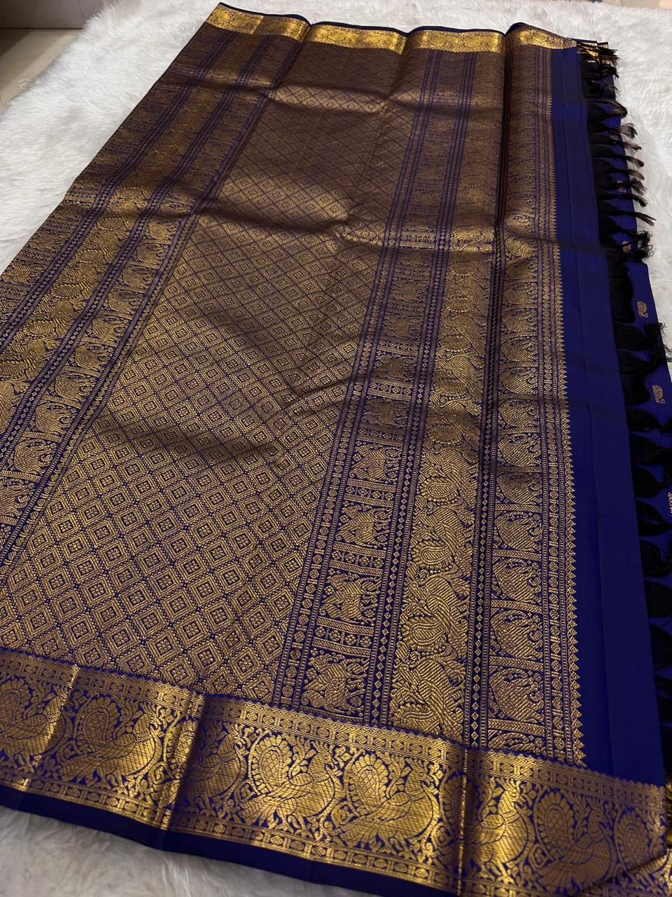 Royal indigo Pure Silk Kanjivaram saree with classic peacock motif border and gold zari detailing