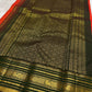 Traditional Kanchipuram Varisaipet saree in festive vermilion red with classic forest green pallu