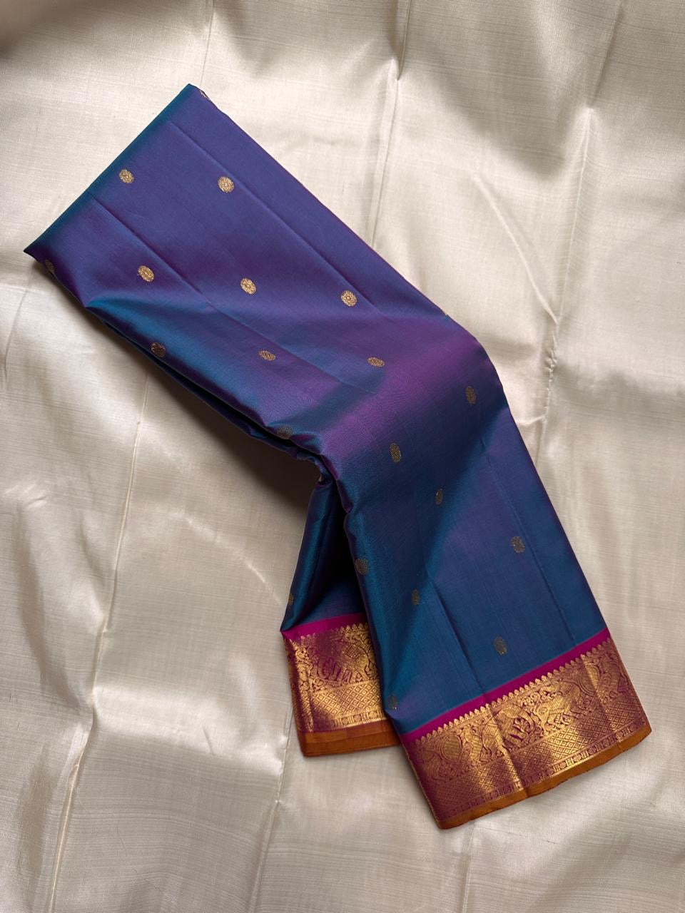 Lotus Crest Blue — Pure Kanchipuram Silk Saree Peacock–blue body with gold buttas & magenta elephant zari-woven borders Silk Mark Certified • Free Shipping within USA • Ships in Two Weeks