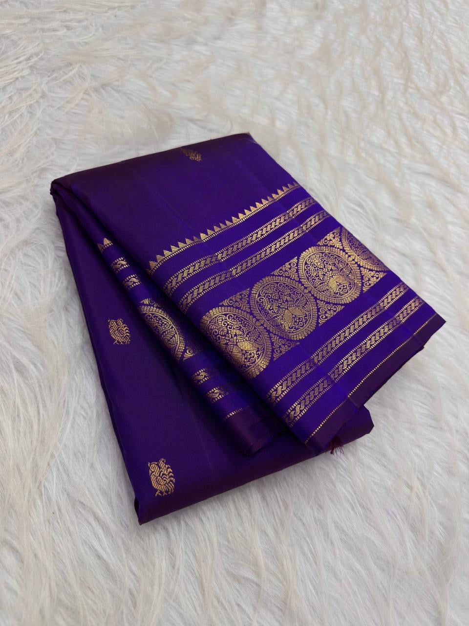 Radiant Neelam Blue pure silk Kanchipuram Varisaipet saree, small zari buttas across the body.