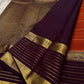 Cinnamon Kattam – Pure Kanchipuram Silk Saree
Vermillion red body with gold kattam checks & floral  buttas
Contrast plum purple korvai borders with rich zari weave
Grand zari pallu with lattice & floral motifs in gold
Silk Mark Certified ships in 2weeks