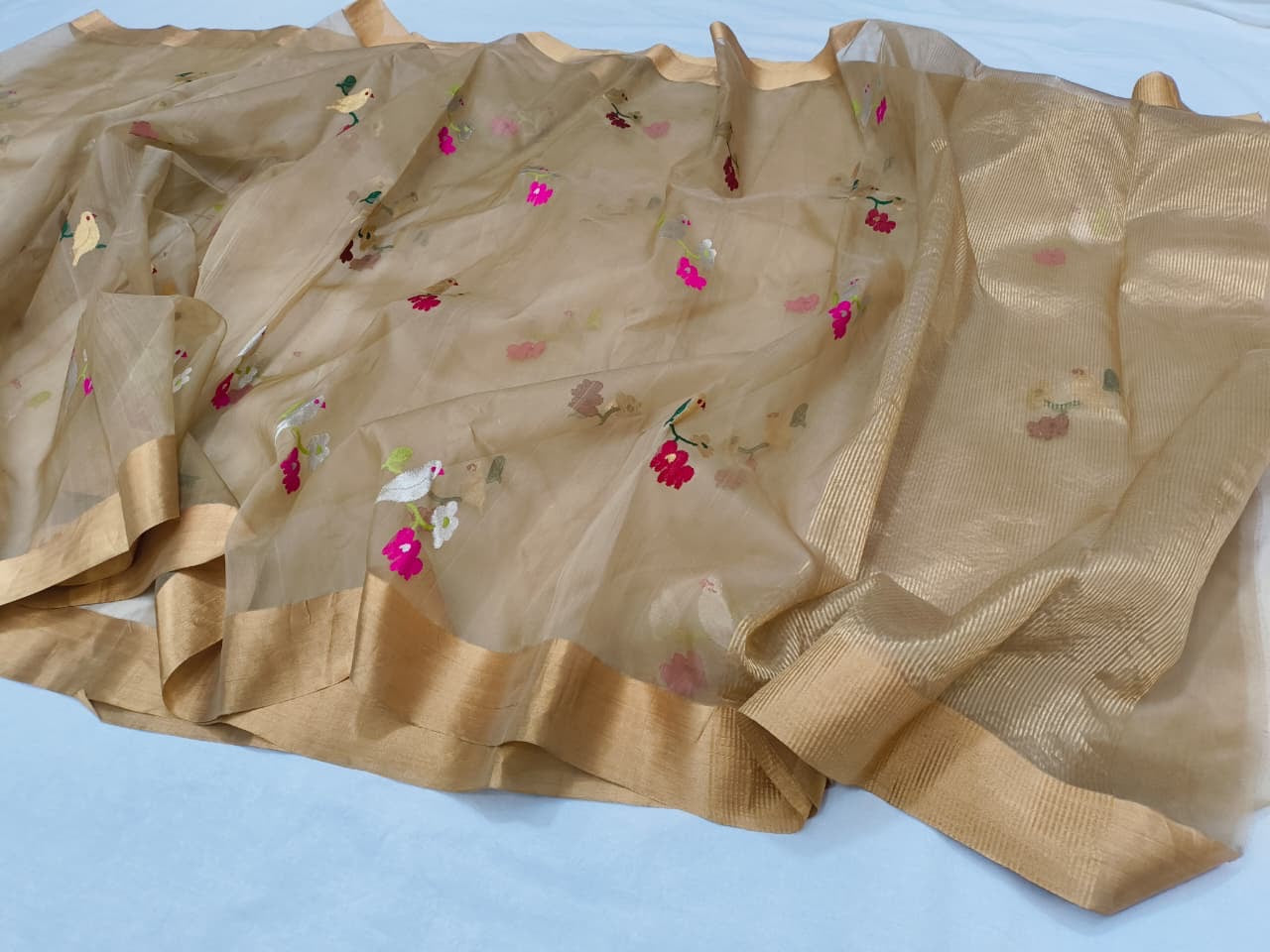 Pure Chanderi Silk Saree
Floral & Bird Embroidery on Sheer Gold-Beige
Tissue Zari Border • Lightweight • Elegant Drape